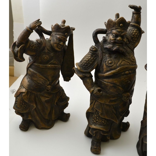 101 - A set of four Chinese ceramic Temple Guardians, each modelled as a fearsome armed figure, tallest 32... 