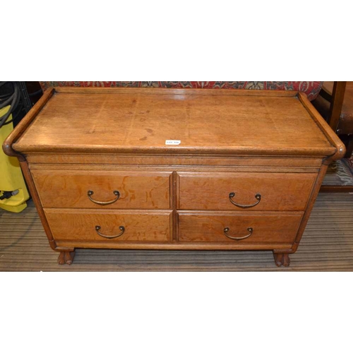 154 - An oak cabinet fitted four drawers, raised on carved claw paw front feet, 87cm wide