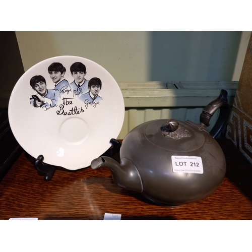 212 - A good Quality Victorian 'melon' tea pot and a saucer decorated with the 'Fab Four'