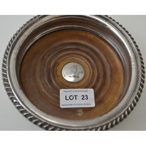 23 - An early 19th century Sheffield plate coaster, to centre engraved greyhound crest, 15cm in diameter