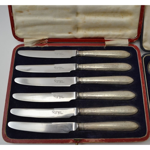 24 - A cased set of six bean handled coffee spoons, Birmingham 1927, and a cased set of six silver handle... 