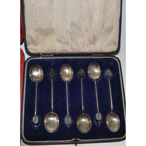 24 - A cased set of six bean handled coffee spoons, Birmingham 1927, and a cased set of six silver handle... 