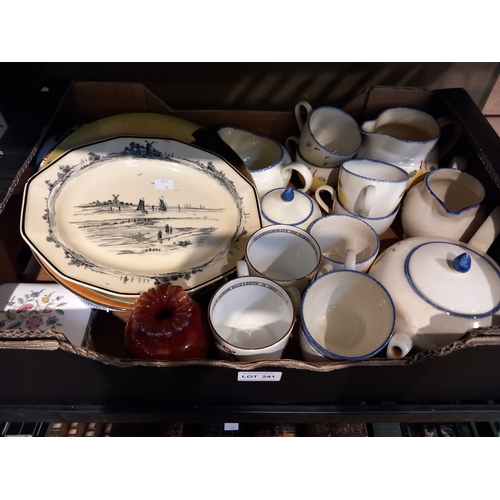 241 - A box containing a Poole studio design tea set with other porcelain items