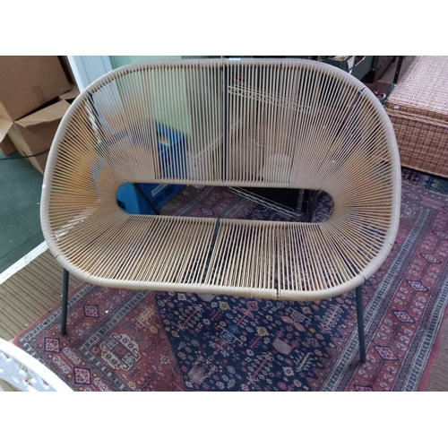 267 - A modern two seater plastic strung garden or conservatory seat