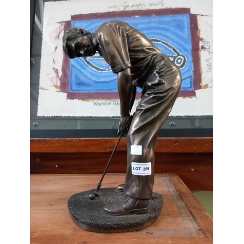 269 - A large golf trophy of a golfer over a putt