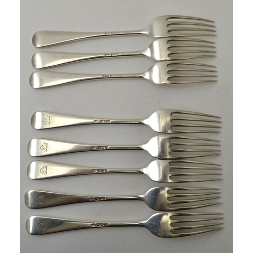 37 - Eight silver Hanovarian pattern dessert forks, comprising a set of five by the Goldsmiths and Silver... 