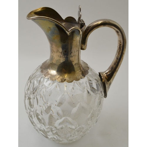 6 - Goldsmiths & Silversmiths Co. A cut glass claret jug with silver mounts, Birmingham 1927, 21cm high