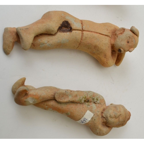 66 - A collection of four Sung Dynasty type, reclining ceramic figures around 13cm long (4)