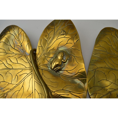 71 - A pair of Arts and Crafts brass wall sconces of Lily pad design, each embossed with a frog and insec... 