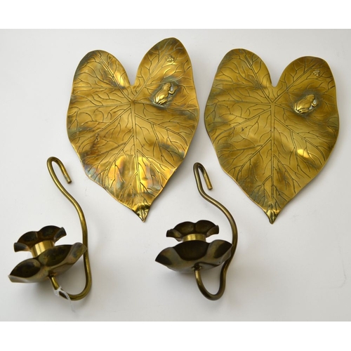 71 - A pair of Arts and Crafts brass wall sconces of Lily pad design, each embossed with a frog and insec... 