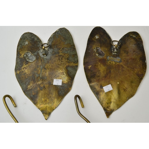 71 - A pair of Arts and Crafts brass wall sconces of Lily pad design, each embossed with a frog and insec... 