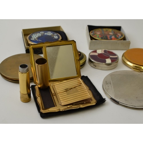 73 - A Stratton brass decorative compact, with integral lipstick holder, together with Stratton and other... 