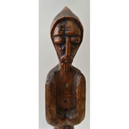 76 - A carved wood and patinated devotional figure, considered to be Northern European in origin, possibl... 