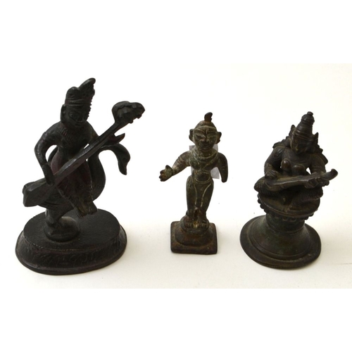 79 - Two cast bronze Far Eastern musician figures, on raised bases, the tallest seated upon a swan, 10cm ... 