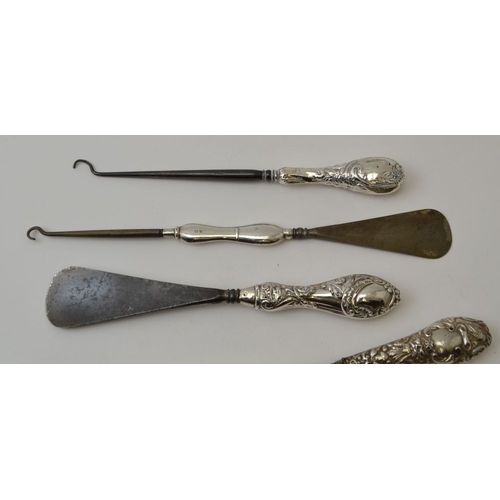 8 - Seven various silver handled items bread fork, pickle fork, shoe horn, glove stretchers, etc.