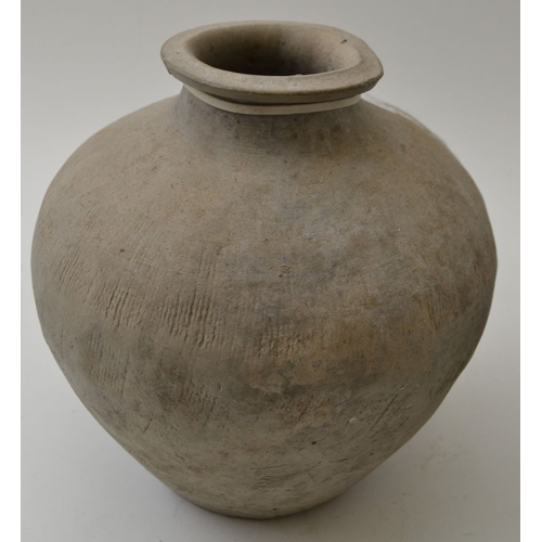 83 - A Chinese ceramic vase, grey tinted, considered to be Neolithic, 16cm high, together with two other ... 