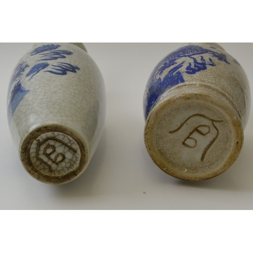 94 - Two official / authorised Chinese ceramic vases, crackle glaze, with printed dragon decoration, the ... 