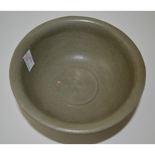 95 - A Chinese celadon crackle glazed pottery bowl, in the Ming style, 15.5cm in diameter