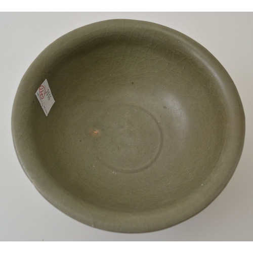 95 - A Chinese celadon crackle glazed pottery bowl, in the Ming style, 15.5cm in diameter