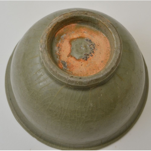 95 - A Chinese celadon crackle glazed pottery bowl, in the Ming style, 15.5cm in diameter