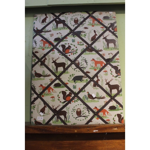 A modern embroidered notice board / letter rack
