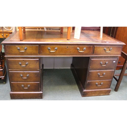 55 - A reproduction mahogany veneer twin pedestal writing desk, leather top, fitted drawers, 137cm wide