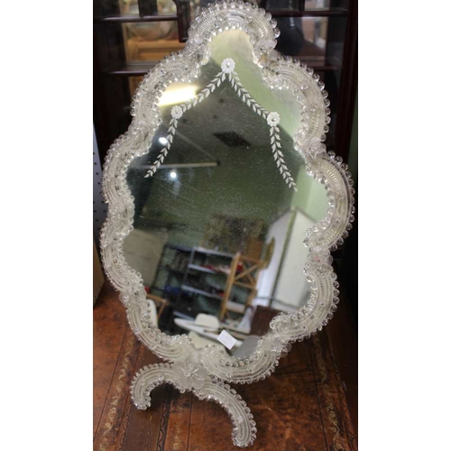 58 - A Venetian dressing table mirror, decoratively framed with easel back. Overall 59cm x 35cm