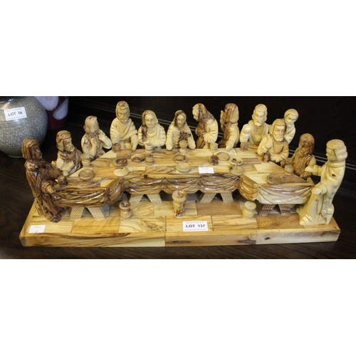 137 - An Olive wood carving, The last Supper, base 49.5cm wide