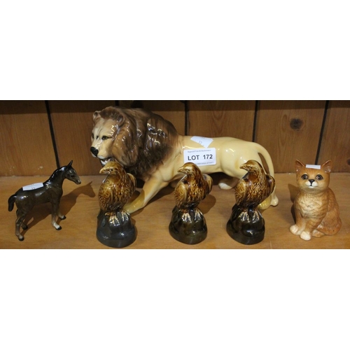 172 - A Beswick Lion. together with a Beswick Kitten, small horse and three small Eagle Whisky decanters (... 