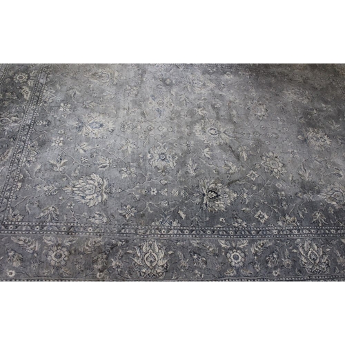 367 - A grey toned machine carpet stylized floral design bordered. 290cm x 200cm