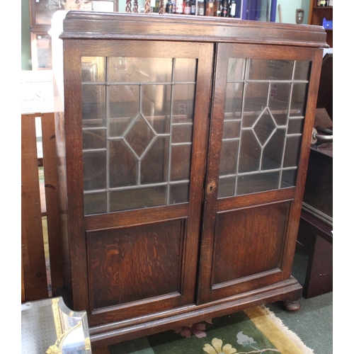 83 - A small leaded glazed door cupboard with a swing mirror