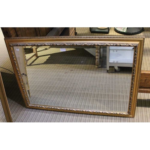 105 - A large bevel edged rectangular gilt frame wall mirror