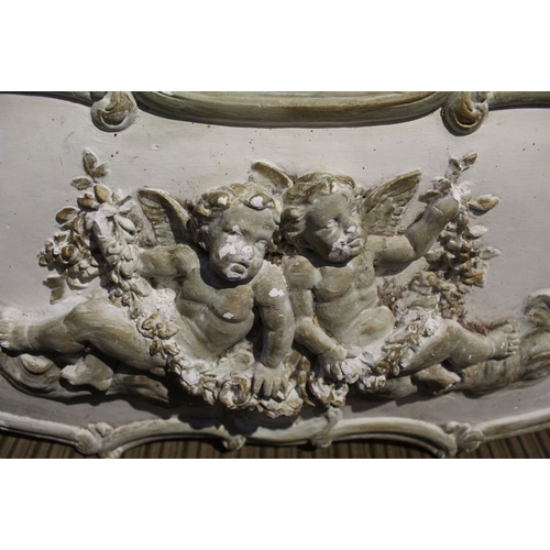 114 - A plaster wall hanging freeze of a pair of cherubs