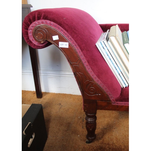 131 - A red upholstered rail back chaise longue