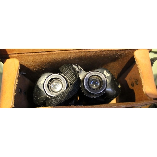 136 - A pair of Tasco binoculars in case with a Prinzlux pair of binoculars with a folding Box Brownie