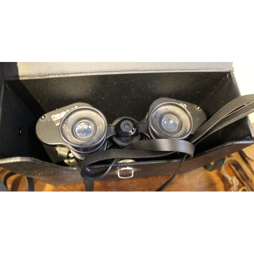 136 - A pair of Tasco binoculars in case with a Prinzlux pair of binoculars with a folding Box Brownie