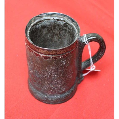 138 - An 18th century leather tankard with white metal band 11cm high, together with a 19th chip carved an... 