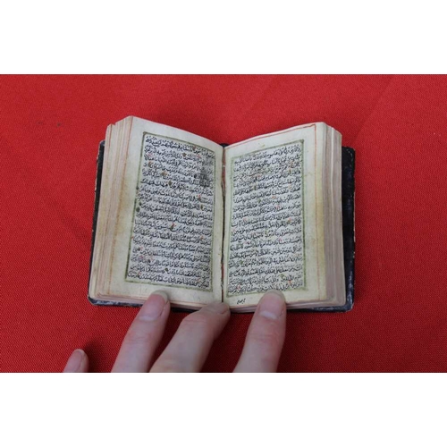 155 - A small bound Koran, 7cm x 5cm