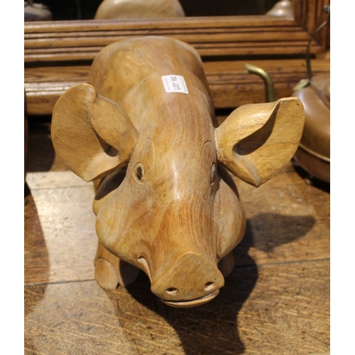 182 - A substantial wooden carved pig