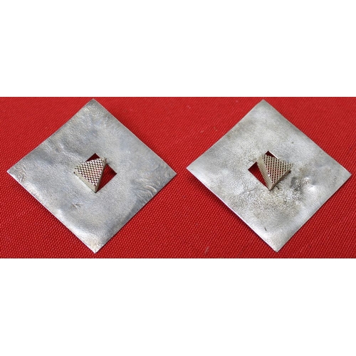 201 - A pair of silver designer earrings of square form with mesh triangles to the centres, together with ... 