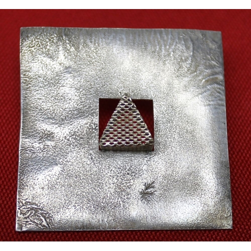 201 - A pair of silver designer earrings of square form with mesh triangles to the centres, together with ... 