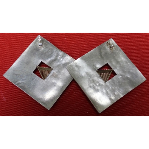 201 - A pair of silver designer earrings of square form with mesh triangles to the centres, together with ... 