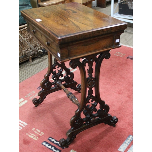 241 - A 19th century rosewood needlework table, the hinged cover opens and rotates to reveal a chess board... 