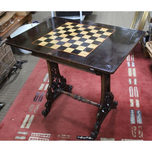 241 - A 19th century rosewood needlework table, the hinged cover opens and rotates to reveal a chess board... 