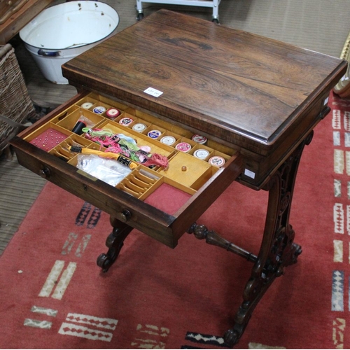 241 - A 19th century rosewood needlework table, the hinged cover opens and rotates to reveal a chess board... 