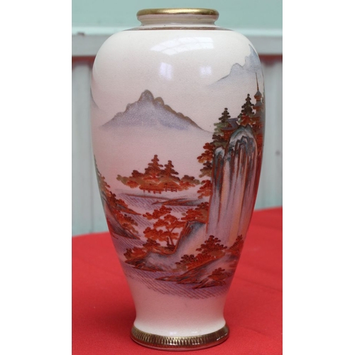 250 - A Japanese satsuma earthen ware vase, gilded & painted with a landscape decoration in the round, 25c... 