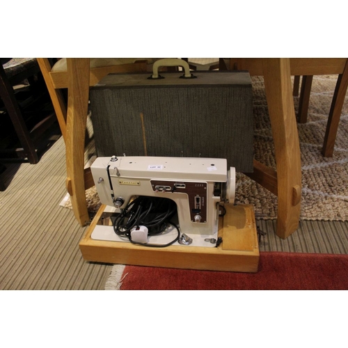 32 - An electric sewing machine by Central in original carry case