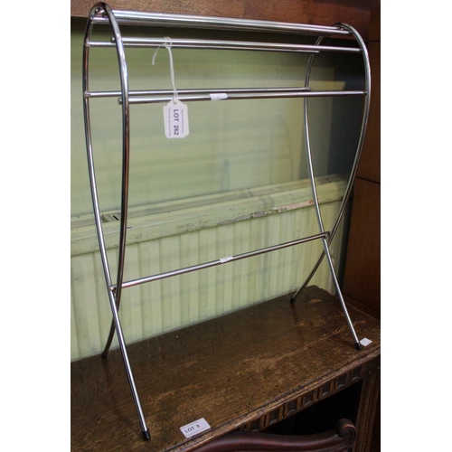 81 - A modernist chromed tear drop magazine rack