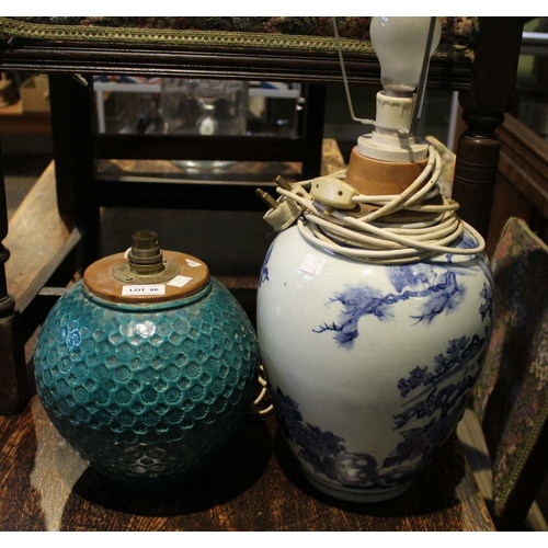 86 - A turquoise bulbous pottery lamp base with an Oriental blue and white example