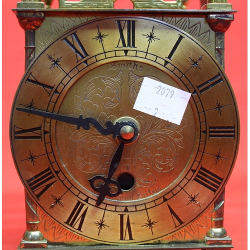 100 - A Smiths brass cased reproduction lantern clock with pierced and engraved decoration, 10.5cm dial wi... 